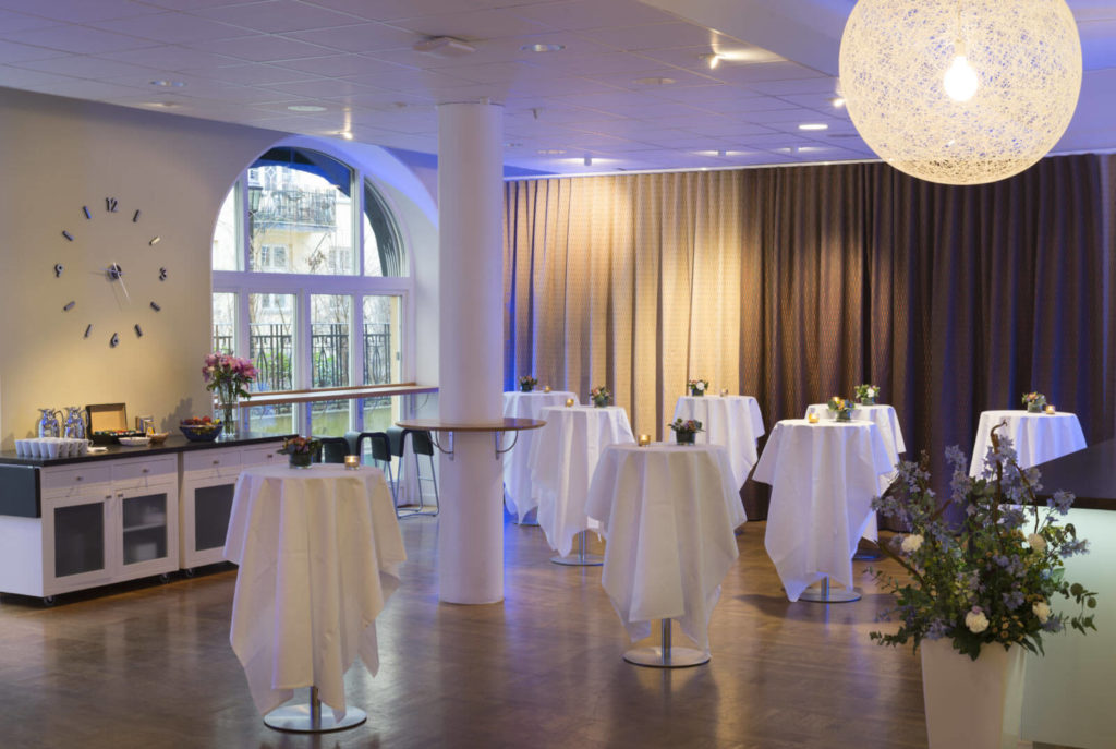 The main foyer with set mingle tables at the IVA Conference Centre